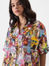 Multiverse Chaos: Animated Character Print Short Sleeve Oversized Shirt Legacy Boutiques Legacy Boutiques